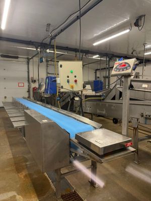 a conveyor belt in the middle of a factory