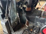 an image of a tractor that is parked in the dirt
