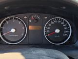 a close up of a car dashboard with a speedometer and gauges
