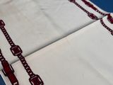 a close up of a piece of cloth with a chain on it