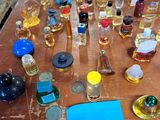 many bottles of alcohol on a table with a price tag