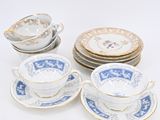six blue and white china cups and saucers