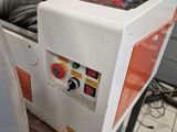a machine that is sitting on a table in a kitchen