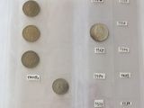 a lot of coins in a plastic bag on a table