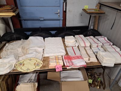 a table with a lot of folded towels and napkins on it
