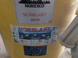 a yellow fire hydrant with a sticker on it