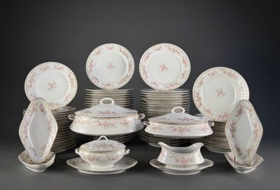 many plates and cups and saucers on the table