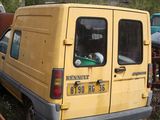 a yellow van that is parked in the grass