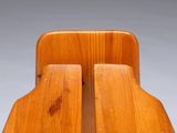 a close up of a wooden table with two pieces of wood on it