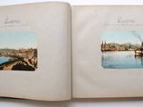 an open book with a picture of a river and a bridge
