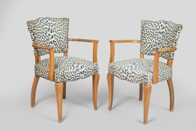 pair of leopard print armchairs with wooden legs