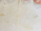 a close up of a cake with pink frosting and gold sprinkles