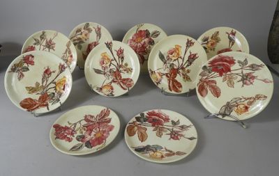 several plates with different designs on them sitting on a table