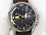a close up of a wrist watch with a glove on it
