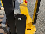 a forklift that is sitting on a pallet