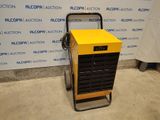 une image représentant une machine jaune et noire posée devant un mur