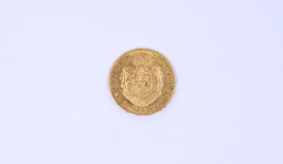 une image d'une pièce d'or sur une surface blanche