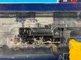 a toy train in a plastic container on display