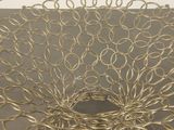 a large metal bowl with a bunch of rings in it