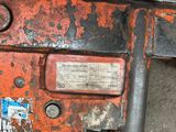 a close up of a rusted machine with a label on it