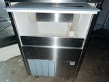 a stainless steel refrigerator and freezer in a room