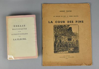 Il y a deux livres sur une table : l'un est un livre et l'autre est un livre avec l'image d'une maison.