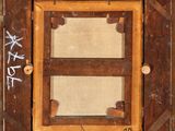 a picture of a wooden frame with writing on it