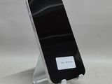 a cell phone that is on a stand on a table