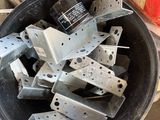 a bucket full of metal parts sitting on a table