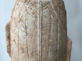 a large stone vase with a design on it