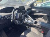 the interior of a car with a steering wheel and dashboard