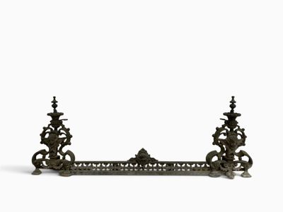 pair of antique cast iron candlesticks in the shape of a mantel