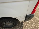 a white van with holes on the side of it