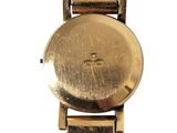 an image of a gold watch on a white background