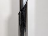 a lamp that is sitting on a metal pole