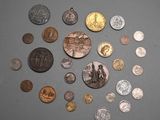 a lot of coins that are on the table