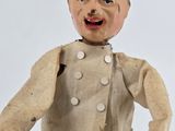a toy of a man with a hat and a cane