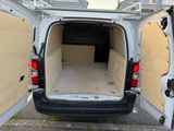 a white van that has its doors open and the back door open