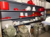 many bags of items on the shelves in the room