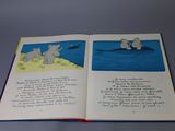 an open book with a picture of two elephants in the water
