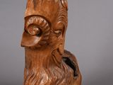 an image of a wooden sculpture of a man with a beard