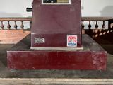 a machine that is sitting on top of a wooden table