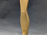 statue of a woman holding a flower in her hand on a wooden base