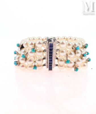 bracelet with pearls and turquoise stones on a white background