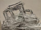 many pieces of furniture wrapped in plastic on a pallet