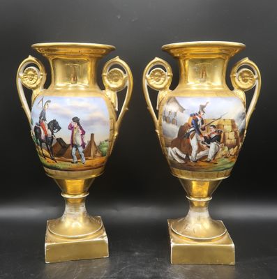 pair of gold vases with painted scenes of soldiers on them