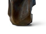 a bronze statue of a man holding a baseball bat