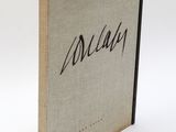 the front cover of a book with a black writing on it