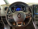 the interior of a car with a steering wheel and dashboard controls