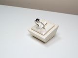 a ring in a ring box on a white table